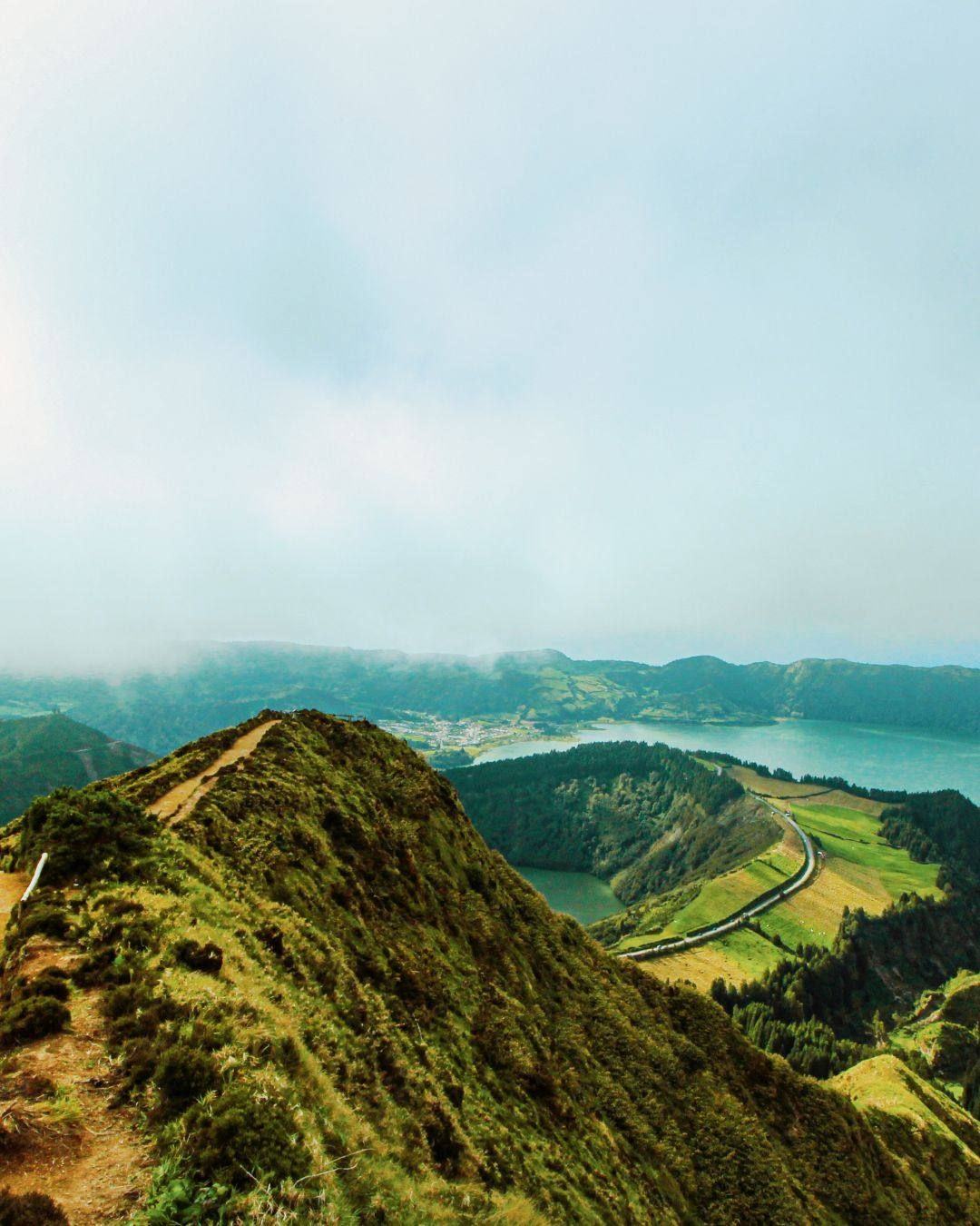 A green volcanic ridge above crater lakes in the Azores