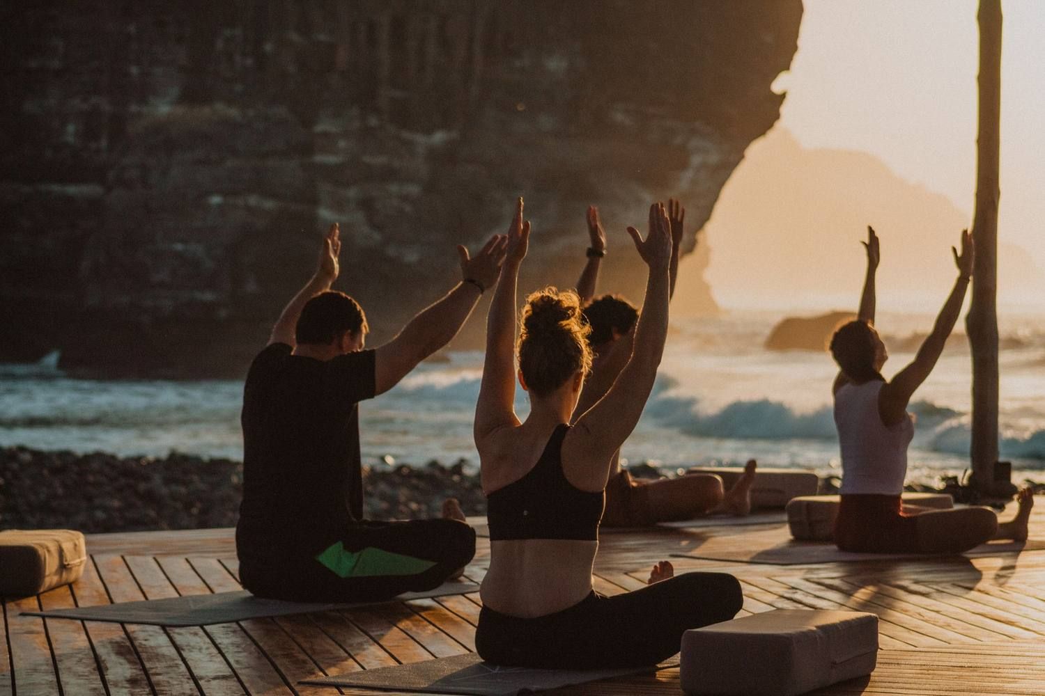 A group in morning practice by the ocean